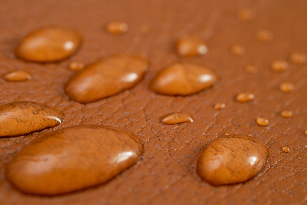 Round,Water,Drops,On,Brown,Leather,Texture,,Side,View,,Soft